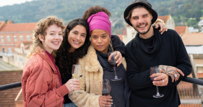Young travellers drinking wine